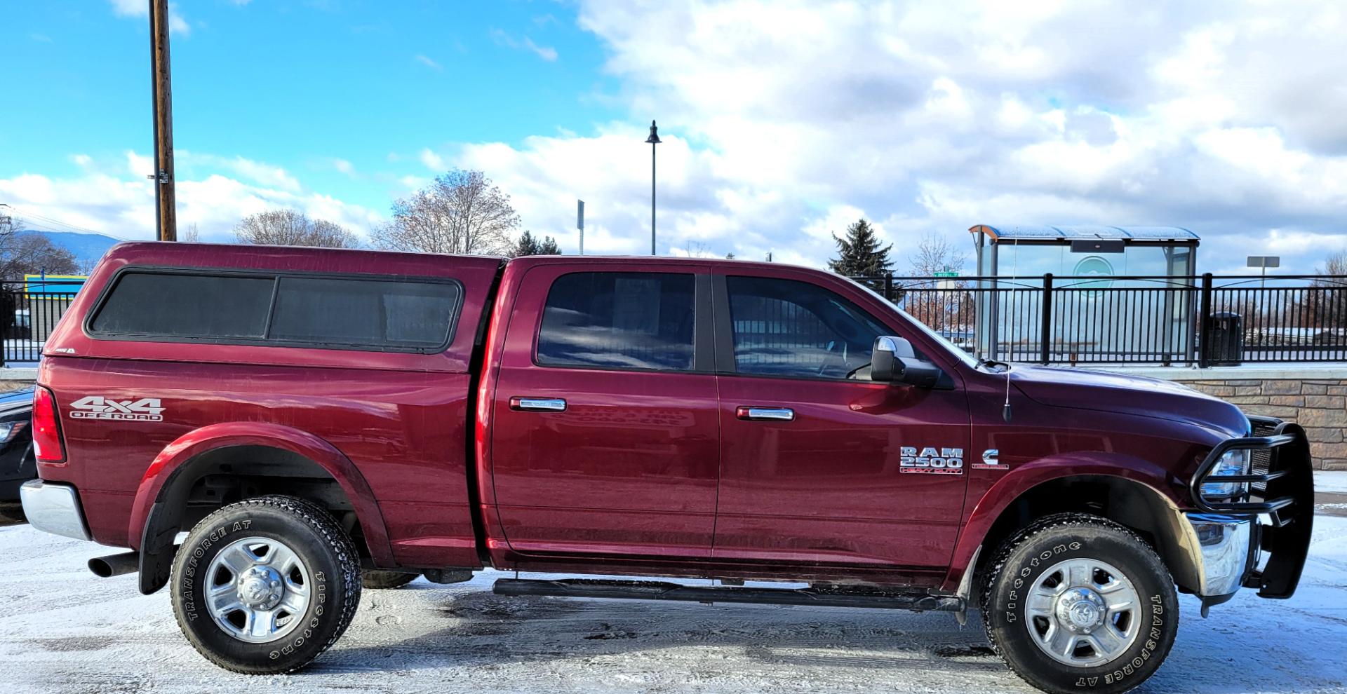 2018 Maroon /Black RAM 2500 SLT (3C6UR5DL4JG) with an 6.7 L Cummins Turbo Diesel engine, 6-Speed Automatic transmission, located at 450 N Russell, Missoula, MT, 59801, (406) 543-6600, 46.874496, -114.017433 - Only 12,839 Miles. Mint Condition/ 4 Wheel Drive. 6.7L Cummins Turbo Diesel. 6 Speed Automatic Transmission. Matching Topper. Touchscreen Display. AM FM Bluetooth. Power Drivers Seat. Air. Cruise. Tilt. Power Windows and Locks. Backup Camera. - Photo#1